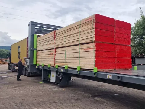 Container being loaded with timber
