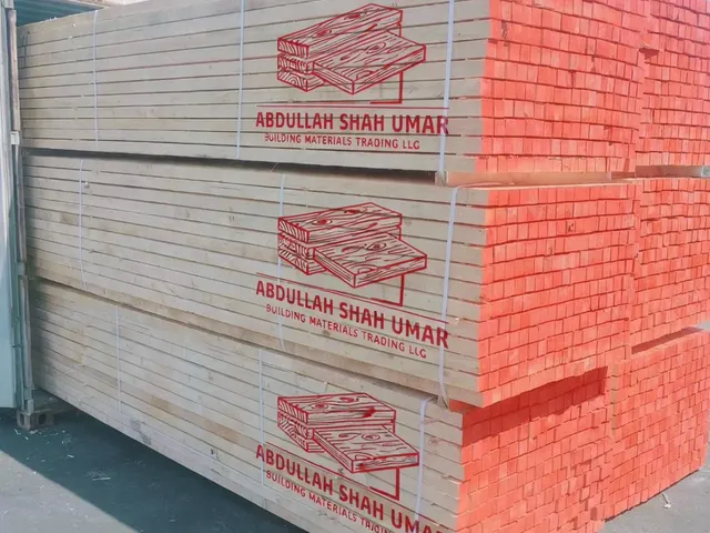 White wood bundles printed with the Abdullah Shah Umar logo in the Sharjah yard